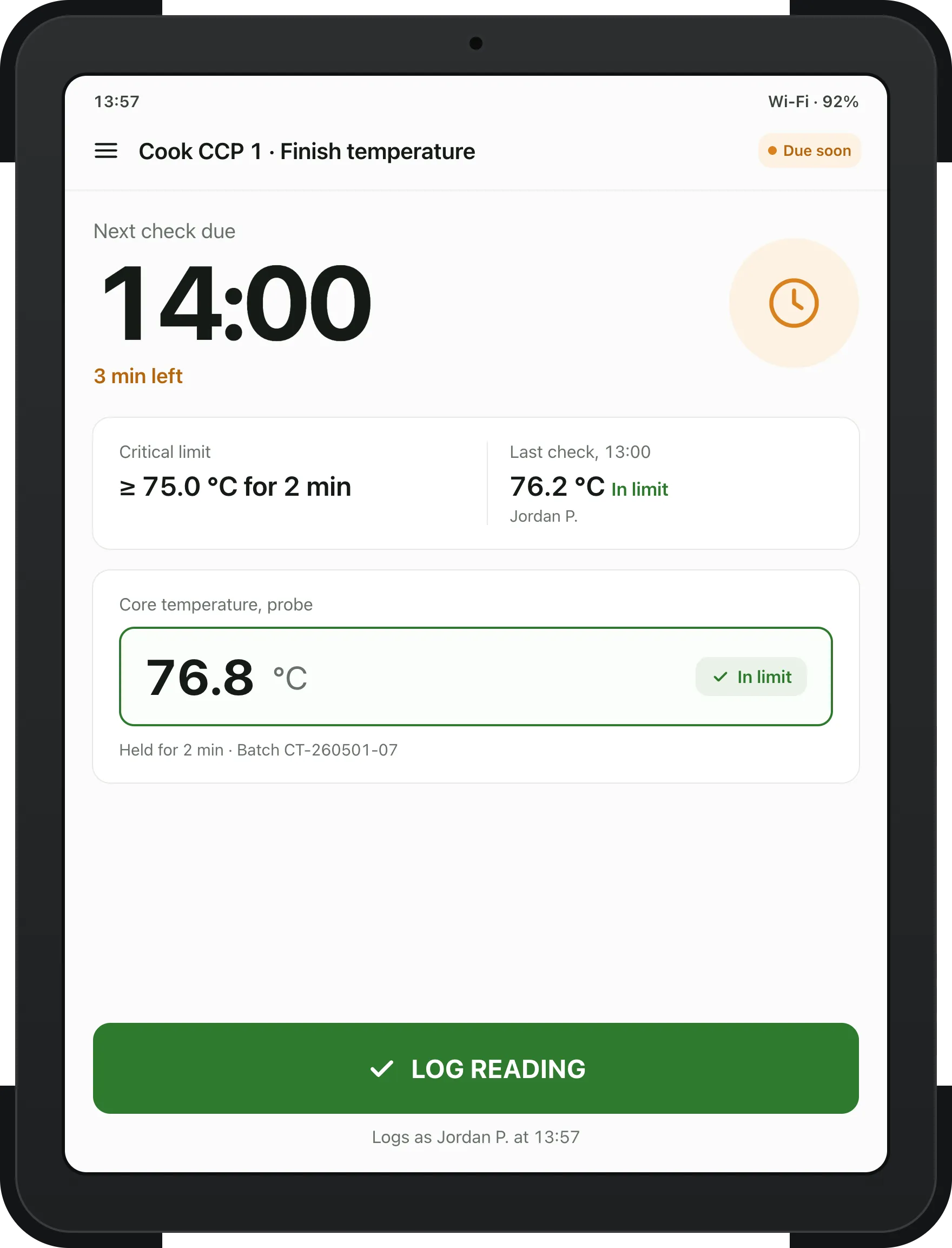Rugged tablet at Cook CCP 1: next check due at 14:00 with 3 minutes left, the critical limit of at least 75.0 °C for 2 minutes, the last check at 76.2 °C, a typed reading of 76.8 °C marked in limit, and a green Log reading button.